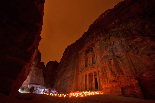 In this undated photo, Petra’s treasury is lit by candles in preparation for Petra By Night (Photo by Muath Freij)
