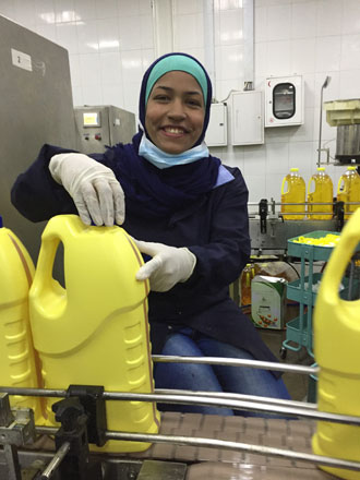 Lamia Abdallah is seen working at the Aqaba Vegetable Oil Factory in Sahab recently (Photo courtesy of WFP/Lara Darwazah)