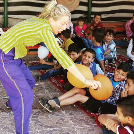 Orphaned children enjoy a fun, interactive show performed by the Wind-Up Penguin Theatre Company in Amman recently  (Photo courtesy of ONE LOVE)