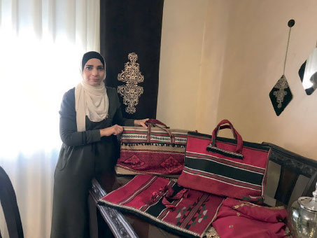 Nabihah Al Sanabara is working on expanding her home-based fabric business (Photo courtesy of CARE Jordan)