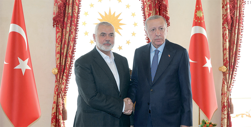 This handout photograph taken and released by Turkish Presidency Press Office on Saturday, shows Turkish President Recep Tayyip Erdogan (right) shaking hands with Ismail Haniyeh, the political leader of the Palestinian movement Hamas, at the Dolmabahce Presidential working office in Istanbul (AFP photo)