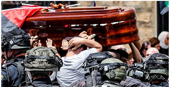 The coffin of slain Al Jazeera journalist Shireen Abu Akleh was almost dropped when Israeli forces attacked the pallbearers at her funeral service on May 13 (AFP photo)