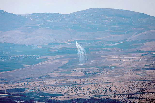 This photo taken from northern Israel near the border with Lebanon shows smoke billowing during Israeli bombardment above the Lebanese Wazzani area on Monday (AFP photo)
