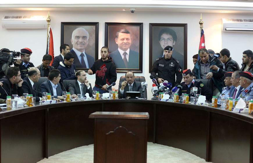Interior Minister Salameh Hammad, flanked by Government Spokesperson Mohammad Momani and PSD Director Maj. Gen. Atef Saudi, holds a press conference on Saturday (Photo by Raad Adayleh)