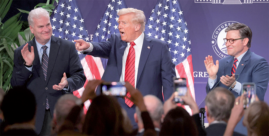 US President Donald Trump acknowledges the crowd as House Majority Whip Tom Emmer (R-MN) (eft) and House Speaker Mike Johnson (R-LA) applaud after Trump addressed the 2025 Republican Issues Conference at the Trump National Doral Miami on Monday in Doral, Florida (AFP photo)