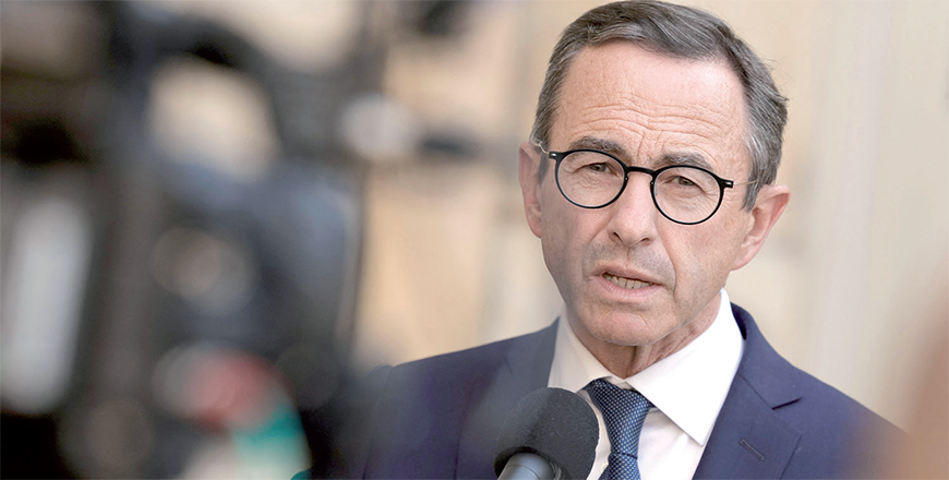 Senator Bruno Retailleau speaks to the press after a meeting with the French prime minister at the Hotel Matignon in Paris on Monday (AFP photo)