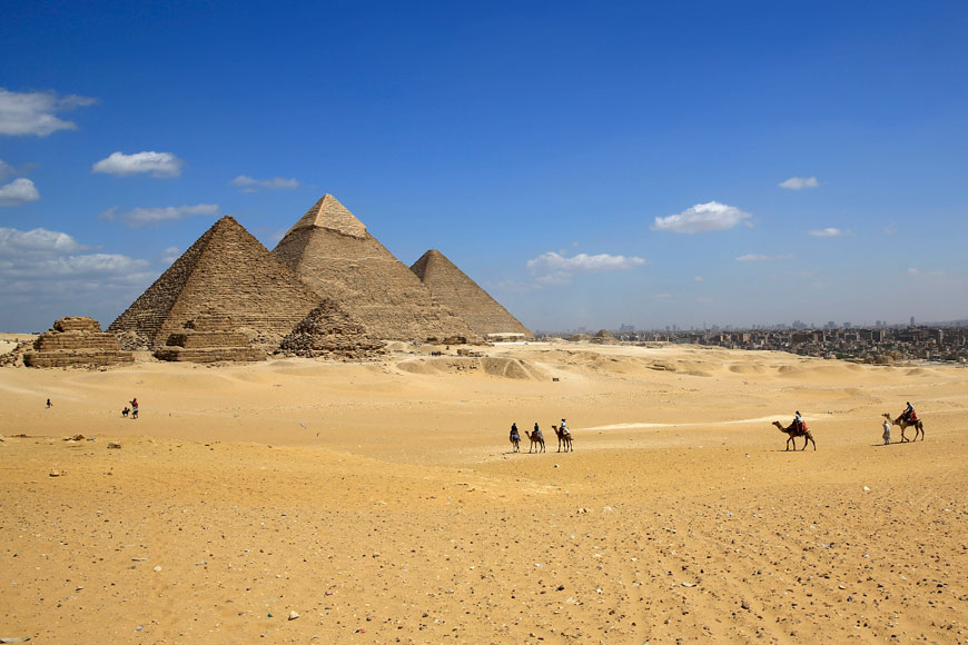 Tourists ride camels at the historical site of the Giza Pyramids, near Cairo, Egypt (AP file photo)
