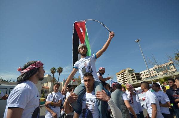 Jordanians cheer for HRH Prince Ali at the Interior Ministry Circle near Al Hussein Youth City in Amman on Friday (Photo by Muath Freij)