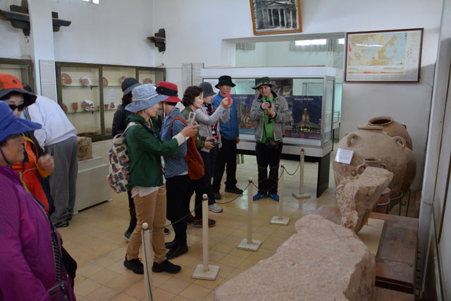 Tourists take pictures of artefacts on display at the Citadel Museum in Amman recently (Photo by Amjad Ghsoun)