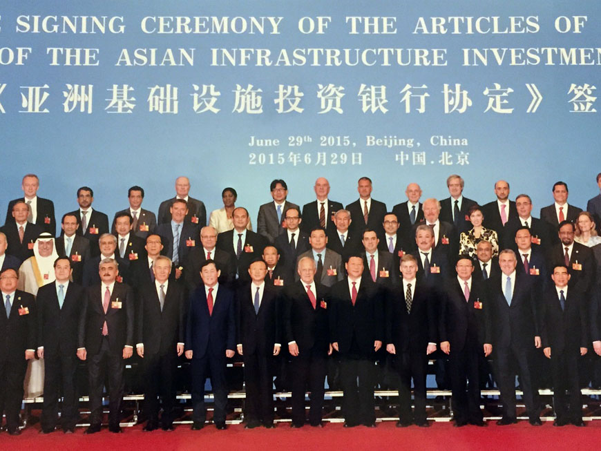 Delegates attending the signing ceremony for the Articles of Agreement of the Asian Infrastructure Investment Bank pose for a group photo in Beijing earlier this week (Photo courtesy of Ministry of Planning and International Cooperation)