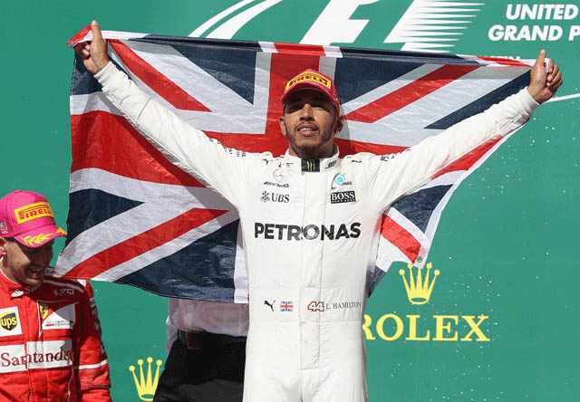 Race winner Lewis Hamilton of Great Britain and Mercedes GP celebrates on the podium during the United States Formula One Grand Prix in Austin, Texas, on Sunday ( AFP photo by Mark Thompson)