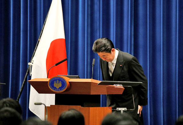 Japan’s Prime Minister Shinzo Abe bows at a news conference after deciding on his Cabinet following parliament reconvening after the general election, at his official residence in Tokyo, Japan, on Wednesday (AFP photo)