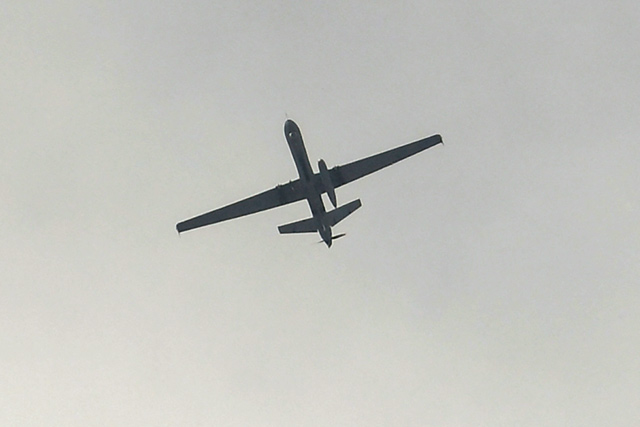 A drone flies over the airport in Kabul, on Tuesday. The US military announced it has completed its withdrawal from Afghanistan after a brutal 20-year war, one that started and ended with the hardline Taliban in power, despite billions of dollars spent trying to rebuild the conflict-wracked country (AFP photo)