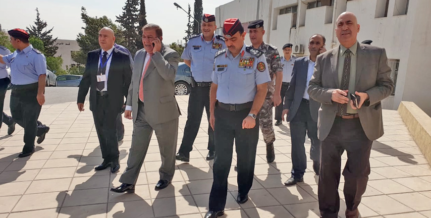 Mahmoud Zreigat (right), director of Bashir Hospital, is escorted by senior interior officials and police officers at the facility on Sunday following threats he had allegedly received after he exposed a major ‘graft case’  (Photo courtesy of Alaa Al Theeb)