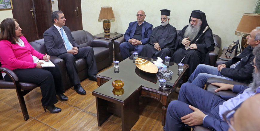 Archbishop of the Greek Orthodox Church in Jordan Christoforos Attallah and an accompanying delegation meet with The Jordan Times Editor-in-Chief Samir Barhoum and Al Rai journalists on Wednesday (JT photo)