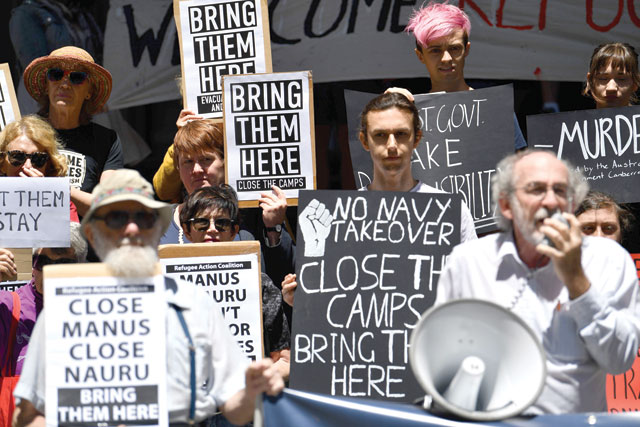 Refugee advocates protest against the closing of asylum-seeker camps in Papua New Guinea, in front of the Sydney Commonwealth government offices, on Tuesday as they demand the resettlement of the refugees to Australia (AFP photo)