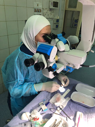 Ophthalmologist cornea specialist Nancy Al Raqqad works on the implant created following an innovative medical procedure (Photo courtesy of Nancy Al Raqqad)