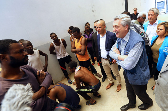 The United Nations' High Commissioner for Refugees Filippo Grandi (right) speaks to illegal immigrants at the Tripoli branch of the Illegal Immigration Authority, in the Libyan capital, on Sunday (AFP photo)