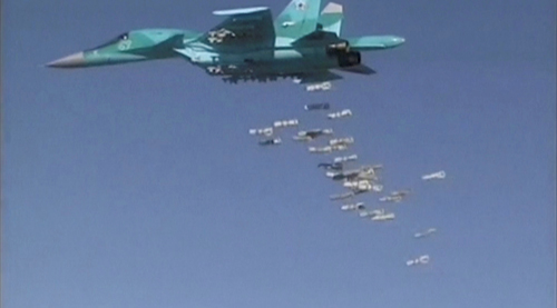 A still image taken from video footage and released by Russia's defence ministry on Thursday shows a Russian Sukhoi Su-34 fighter-bomber based at Iran's Hamadan Air Base, dropping off bombs in the Syrian province of Deir Ezzor (Reuters photo)