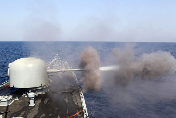 A Saudi warship fires a shell during Gulf Shield 1exercise by members of Royal Saudi Navy, east of Saudi Arabia, on Sunday (Reuters photo)