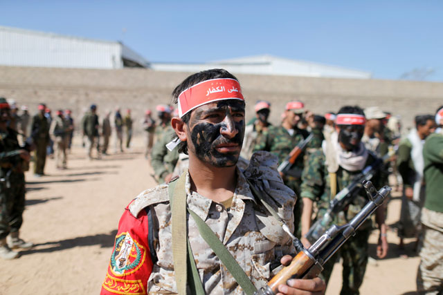 Newly recruited Houthi fighters take part in a parade before heading to the battle front to fight against government forces in Sanaa, Yemen, on Wednesday (Reuters photo)