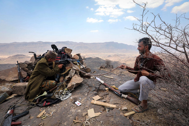 Yemeni tribesman from the Popular Resistance Committee, supporting forces loyal to Yemen's Saudi-backed President Abed Rabbo Mansour Hadi, fires a gun in the country's third-city Taez during clashes with Shiite Houthi rebels on Sunday (AFP photo)