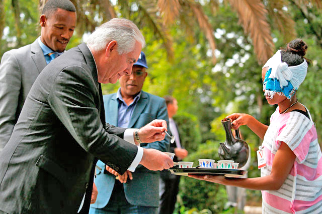 US Secretary of State Rex Tillerson (left) receives a cup of brewed coffee during a traditional coffee ceremony at the US embassy in Addis Ababa on Thursday (AFP photo)