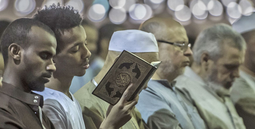 Egyptians chant the Taraweeh recitations on the occasion of Laylat Al Qadr during the fasting month of Ramadan at Cairo's historic mosque of Amr Ibn Al Aass on Wednesday (AFP photo)