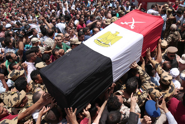 Egyptians carry the coffin of a soldier, who was killed a day earlier in the restive Sinai Peninsula in an attack by the Daesh terror group, during a funeral ceremony in the 10th of Ramadan city, about 60 km north of Cairo, on Saturday (AFP photo)