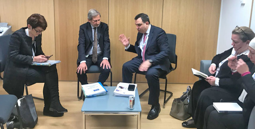 Planning Minister Imad Fakhoury speaks with EU Neighbourhood Policy and Enlargement Negotiations Commissioner Johannes Hahn on the sidelines of Brussels II  recently (Photo courtesy of Planning Ministry)