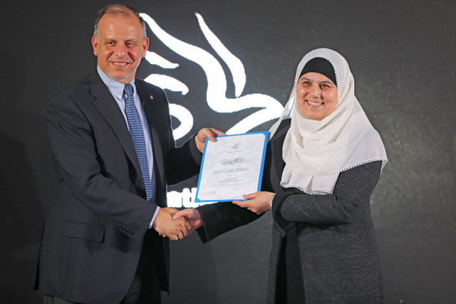 HRH Prince Feisal honours a volunteer from the Nashatati programme at Generations For Peace premises in Amman on Monday  (Photo courtesy of Generations For Peace)