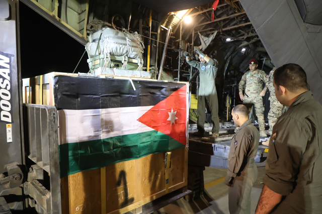 The Jordan Armed Forces-Arab Army says that a Royal Jordanian Air Force aircraft air-dropped on Monday urgent medical aid via parachutes to the Jordan field hospital in Gaza  (Petra photo)