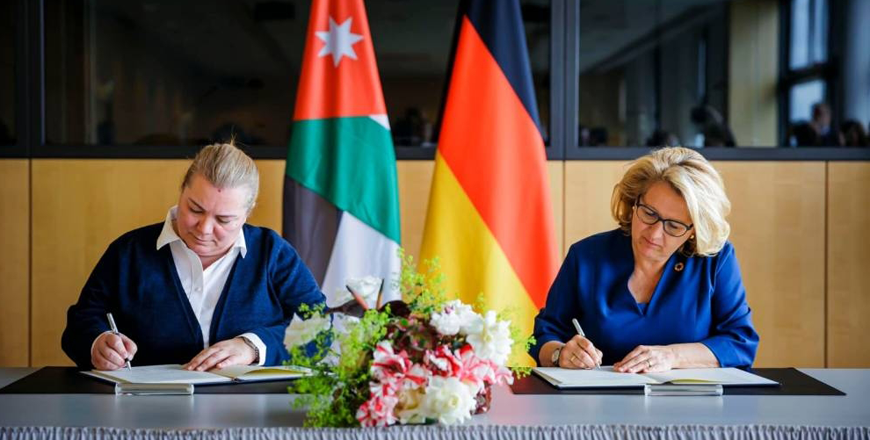 Minister of Planning and International Cooperation Zeina Touqan (left) and German Minister for Economic Cooperation and Development Svenja Schulze sign official minutes of the Jordanian-German talks in Berlin, which outline a new aid package for Jordan of approximately 619 million euros in grants and concessional loans over the period, according to a Planning Ministry statement (Petra photo)
