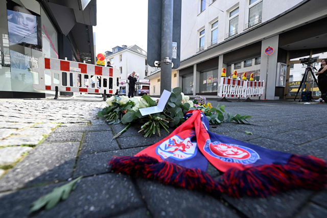 Flowers for the victims are placed on August 24, 2024 near the scene where at least three people were killed and several injured when a man attacked them with a knife on late August 23, 2024 in Solingen, western Germany, during a festival to mark the city's 650th anniversary (AFP photo)