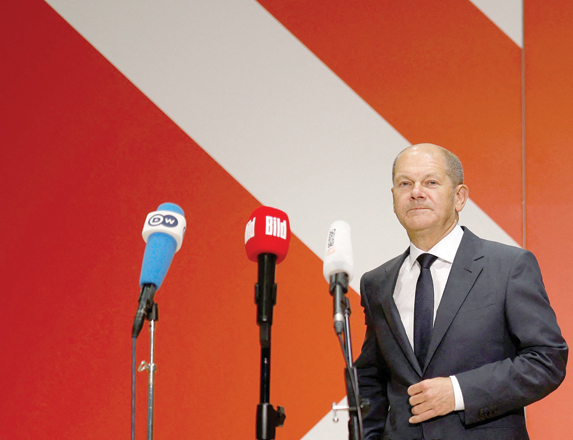 German Finance Minister, Vice Chancellor and the Social Democratic SPD Party's candidate for chancellor Olaf Scholz arrives to give a press statement at the headquarters of the SPD in Berlin, southern Germany, on Wednesday (AFP photo)
