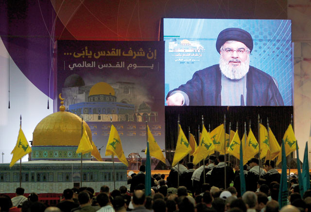 Lebanon’s Hizbollah leader Sayyed Hassan Nasrallah addresses his supporters via a screen during a rally marking Al Quds day in Beirut’s southern suburbs, Lebanon, June 23 (Reuters photo)