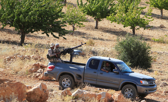 Hizbollah fighters are seen in a truck in Jroud Arsal, near Syria-Lebanon border, on August 13, 2017 (Reuters file photo)