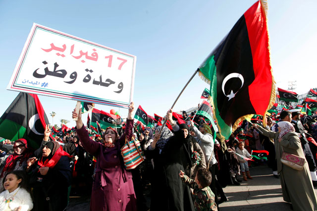 Libyans take part in celebrations marking the sixth anniversary of the Libyan revolution in Tripoli, Libya, on Friady. The placard reads: ‘February 17, united homeland’ (Reuters photo)