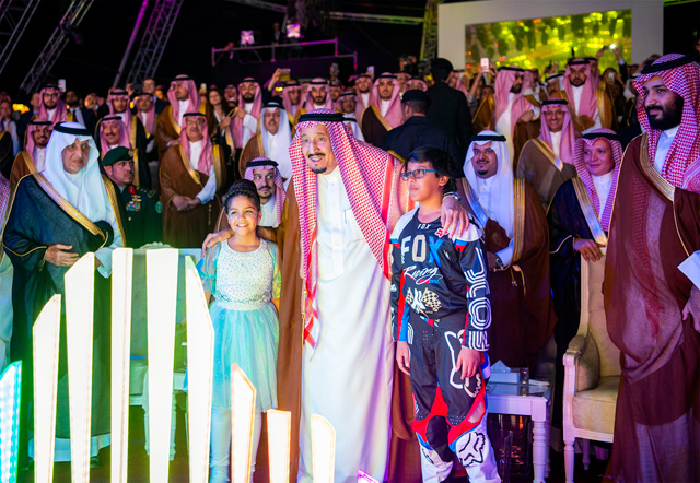 This handout photo provided by the Saudi Royal Palace on Saturday shows Saudi King Salman Bin Abdulaziz (centre) and his son, Crown Prince Mohammed Bin Salman (far-right), embracing two children (AFP photo)