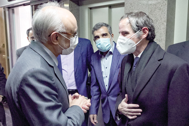 A grab from an AFPTV video taken on Sunday, shows the head of the Atomic Energy Organisation of Iran (AEIO) Ali Akbar Salehi (left) and AEIO spokesman Behrouz Kamalvandi (centre) meeting with the visiting Director General of the International Atomic Energy Agency (IAEA) Rafael Grossi (right) in the capital Tehran (AFP photo)