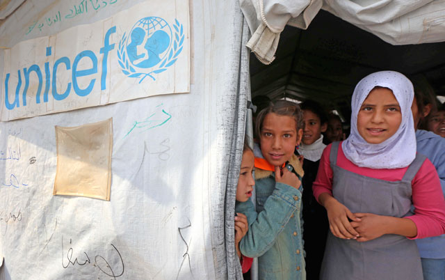 Displaced Iraqi children from the former embattled city of Mosul are seen at a United Nations Children’s Fund school at the Hasan Sham camp, some 40km east of Erbil in northern Iraq, on Monday (AFP photo)