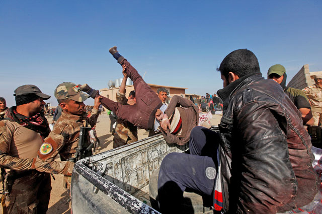 Iraqi Special Operations Forces arrest a person suspected of belonging to Daesh militants in western Mosul, Iraq, on February 26 (Reuters photo)