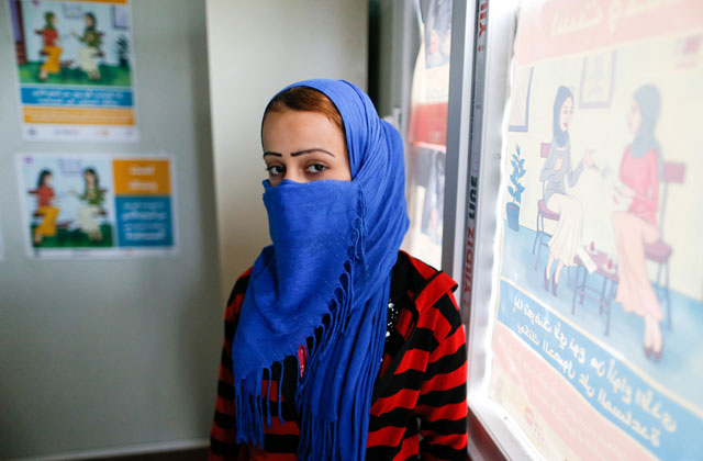 A displaced woman, who was rescued after being kidnapped by the Daesh terror group militants, poses at Khazir camp, Iraq, on Tuesday (Reuters photo)