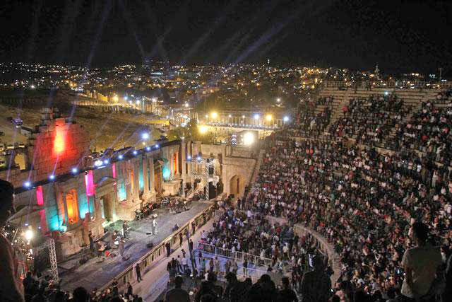Audiences attend a concert at the ancient Greco-Roman city of Jerash as part of the 31st Jerash Festival for Culture and Arts in 2016 (Photo by Hassan Tamimi)