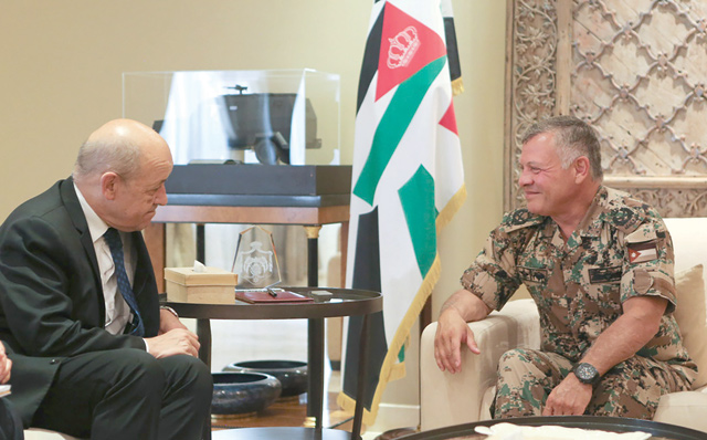 His Majesty King Abdullah meets with French Minister of Europe and Foreign Affairs Jean-Yves Le Drian in Amman on Thursday (Photo courtesy of Royal Court)