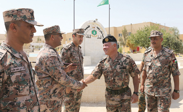 His Majesty King Abdullah visits the training school of non-commissioned officers in Khao near Zarqa on Monday (Photo courtesy of Royal Court)