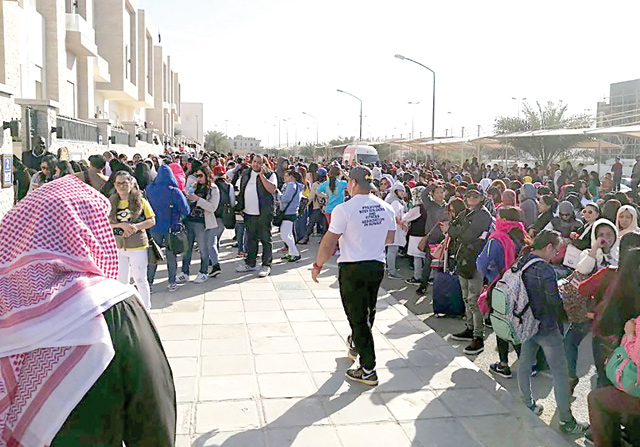 This handout photo released on February 20 by the Kuwaiti newspaper, Kuwait Times, shows Filipino workers trying to get amnesty waiting outside the Philippine embassy in Kuwait City (AFP photo)