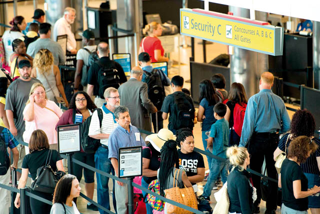 This file photo taken on June 29 shows travellers waiting in line at the security checkpoint at Baltimore-Washington International Airport in Baltimore, Maryland (AFP photo)