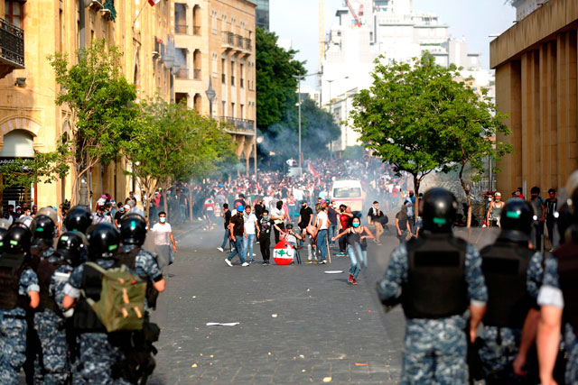 Lebanese protesters clash with riot police following a demonstration in central Beirut on Saturday (AFP photo)