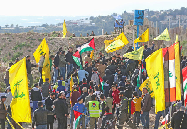 Lebanese supporters of Hizbollah attending a rally against the US president's decision to recognise Jerusalem as the capital of Israel, on Sunday, in the southern Lebanese village of Alma Al Shaab, on the border with Israel (AFP photo)
